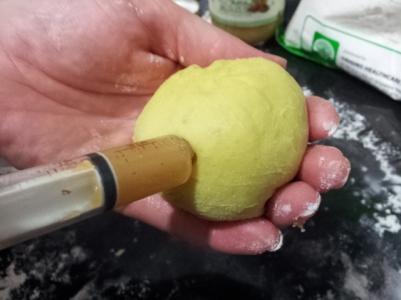 injecting kaya jam into brioche buns